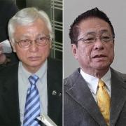 意見が食い違う犬飼会長（右）と鬼武委員長