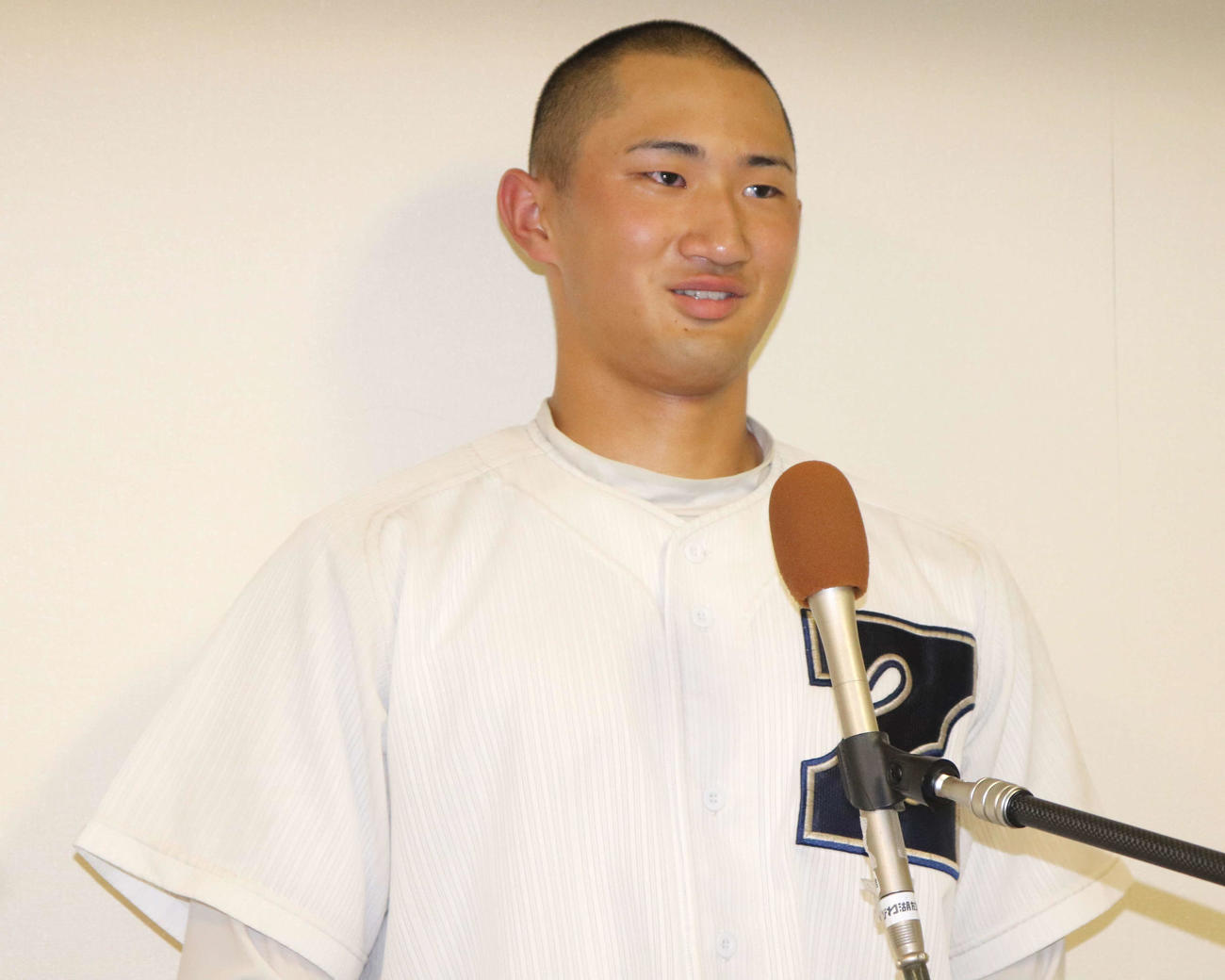 伊香との1回戦に出場し、試合後取材に応じる膳所の主将・關士道（せき・しどう）外野手（3年）