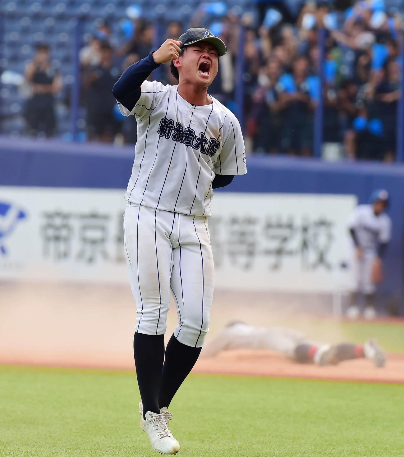 7月23日、中越戦で勝利し、ガッツポーズする新潟産大付・宮田