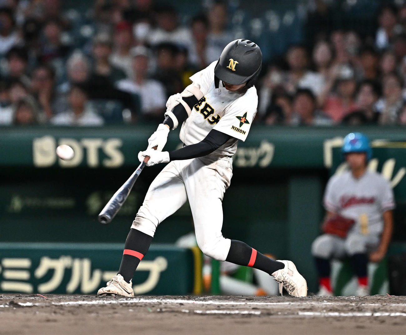 京都国際対札幌日大　9回裏札幌日大2死一、三塁、帯川は右越え2点適時三塁打を放つ（撮影・滝沢徹郎）