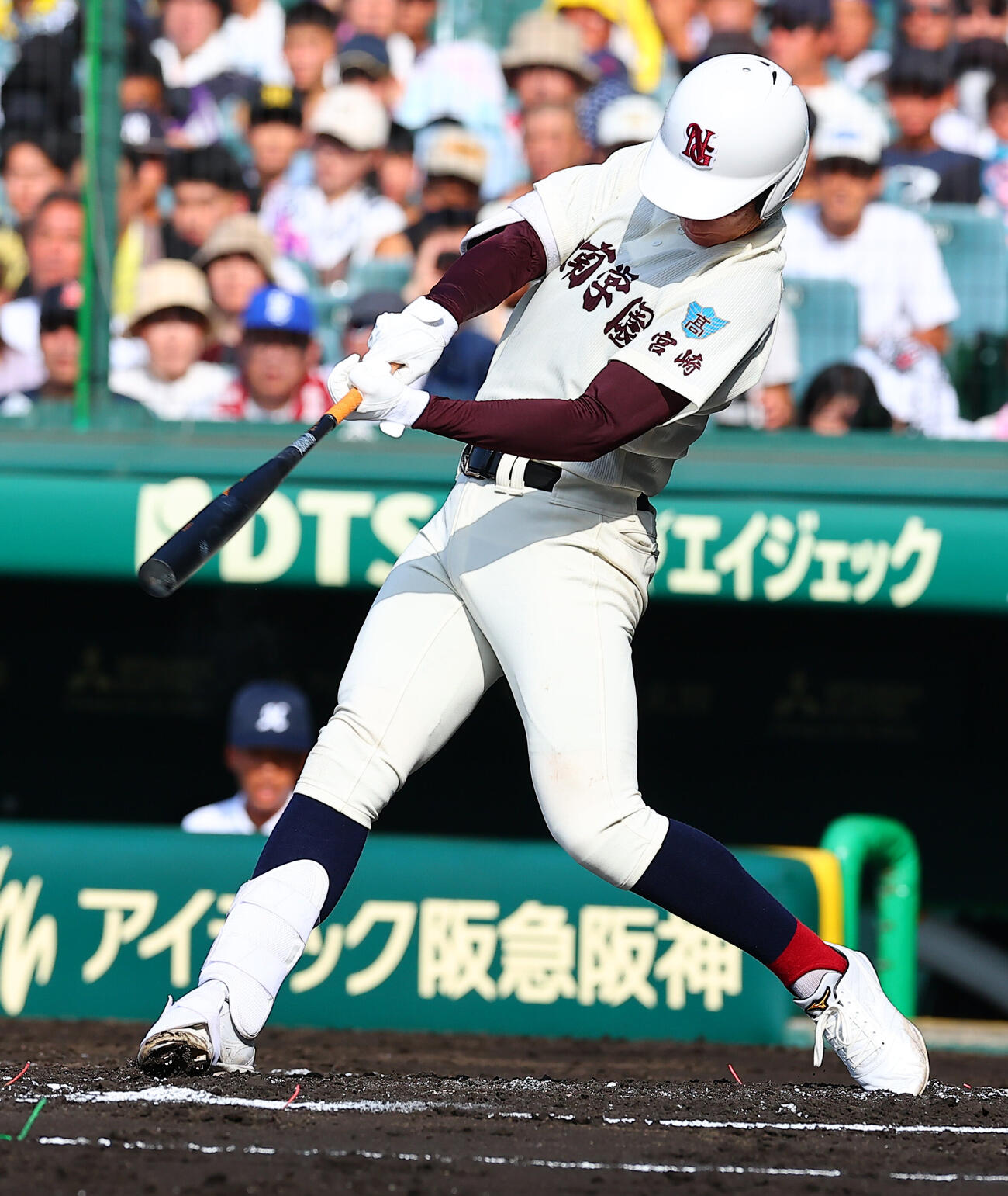 8月10日の明徳義塾対日南学園　1回裏日南学園2死、三塁打を放つ田中皐晴（撮影・野上伸悟）