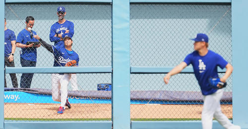 ドジャース対ジャイアンツ　試合前、キャッチボールをする山本由伸（手前）を前にブルペンで投球練習をするドジャース大谷（撮影・菅敏）