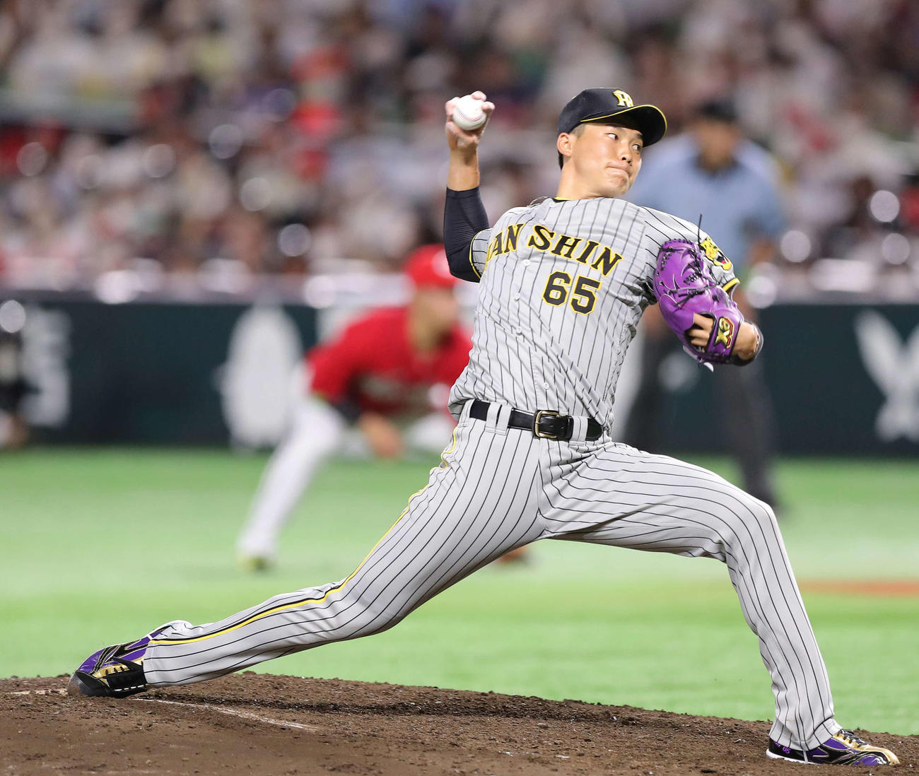 7回裏、全セ5番手で登板する阪神湯浅京己（撮影・河田真司）