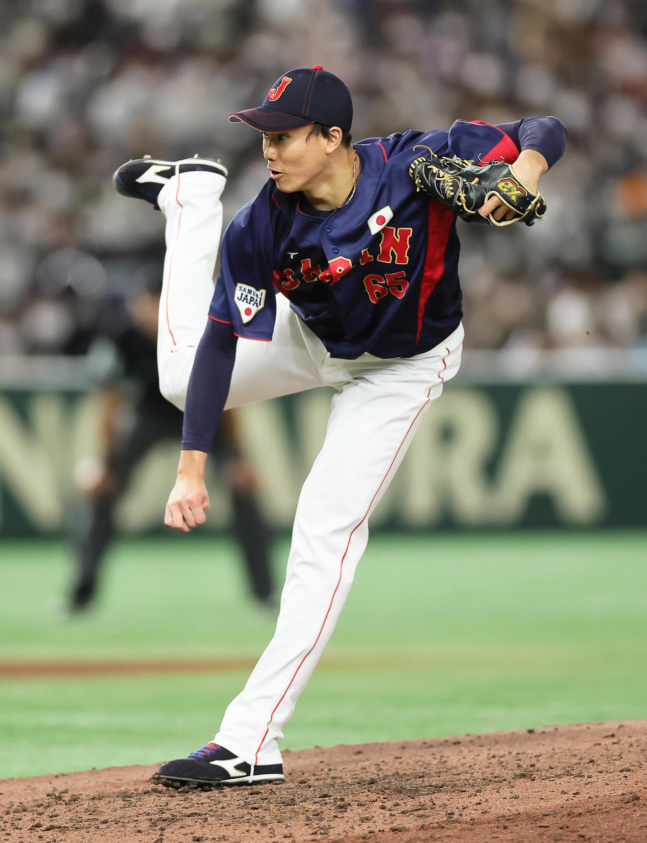 巨人対日本代表　7回裏を3人で仕留め、勝利投手となった日本代表湯浅（撮影・足立雅史）