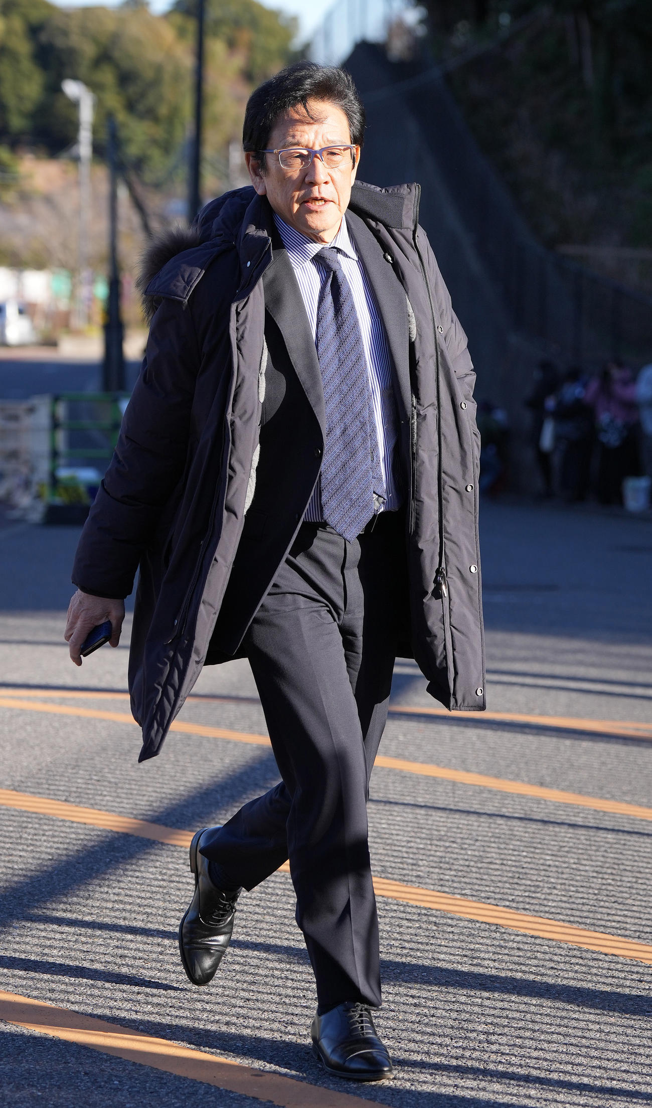 スカウト会議に向かう日本ハム栗山CBO（撮影・鈴木みどり）