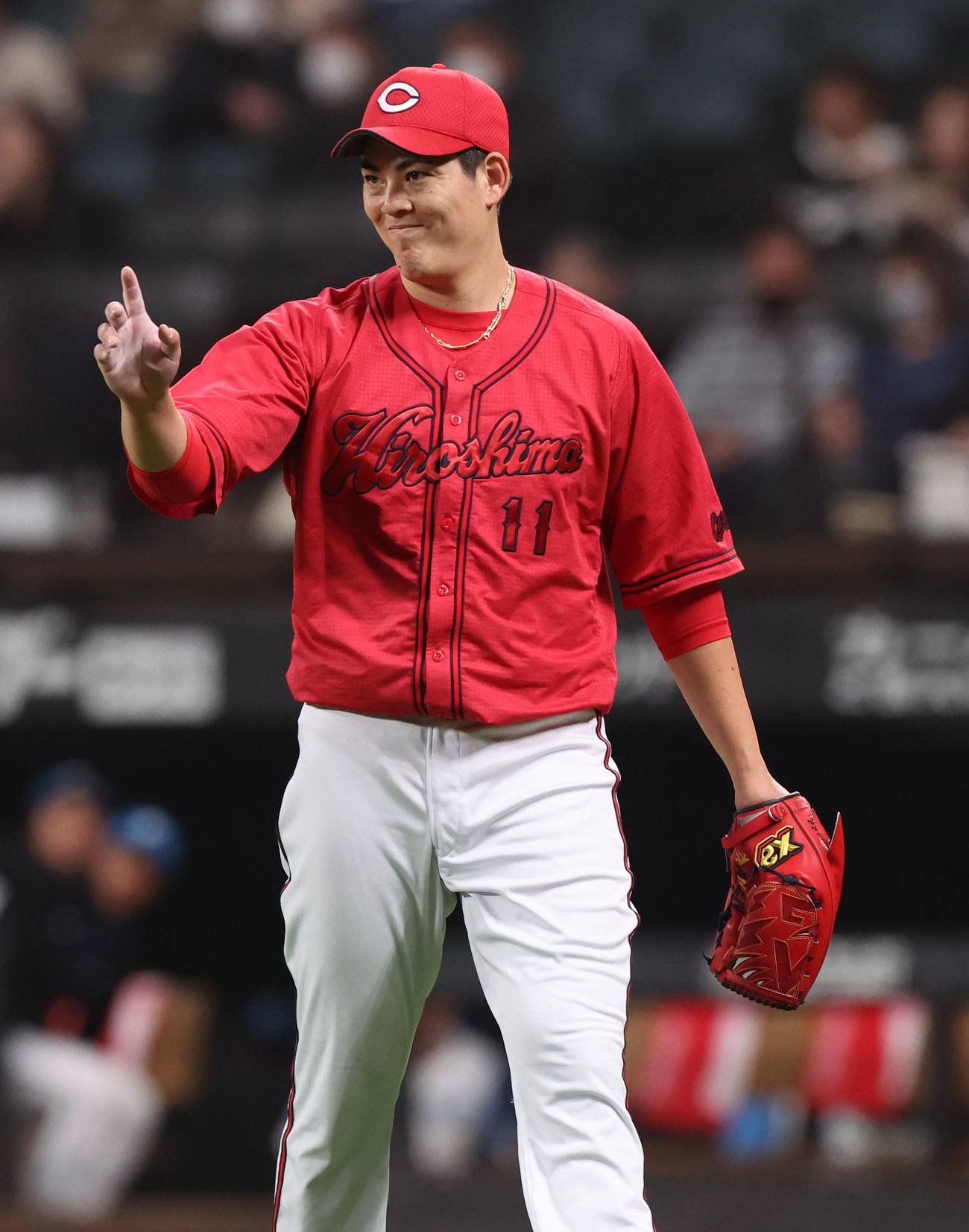 日本ハム対広島　5回裏を無失点に抑え笑顔を見せる広島九里（撮影・佐藤翔太）