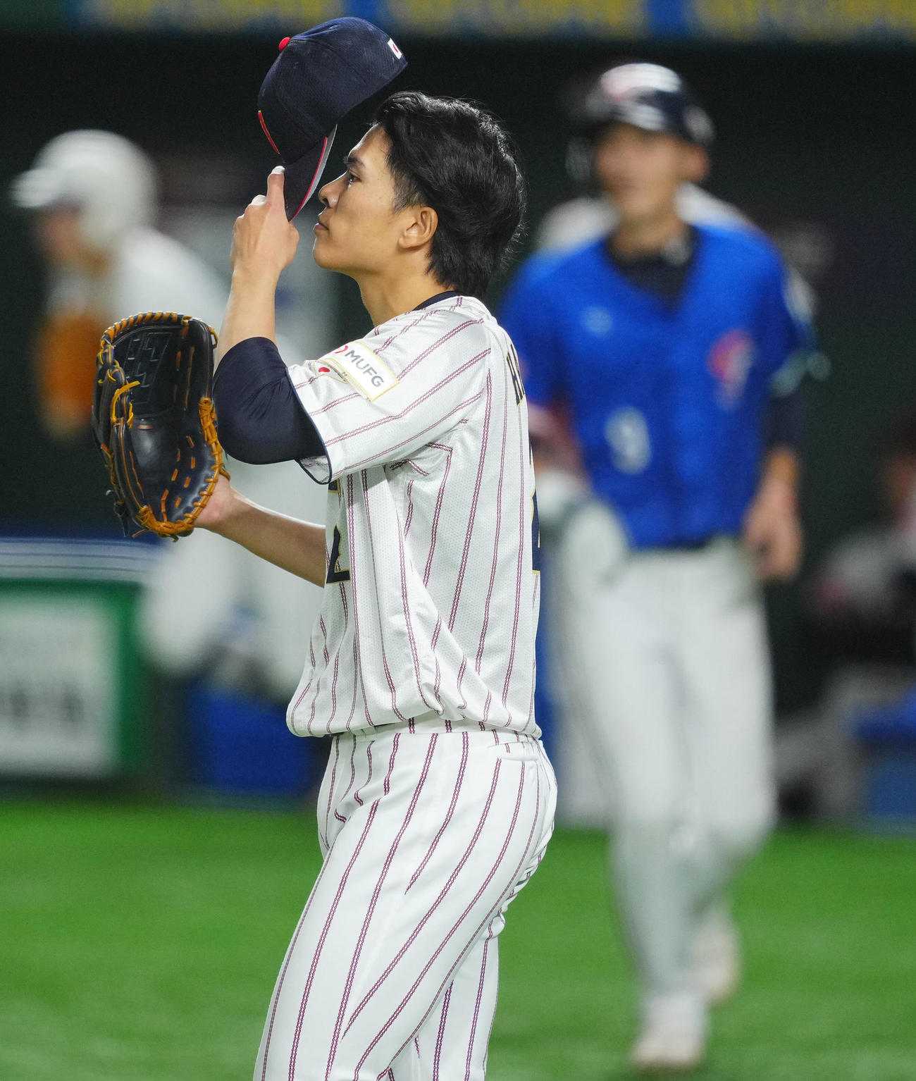 日本対台湾　5回表台湾無死一、二塁、林立に適時打を許しさえない表情の早川（撮影・垰建太）