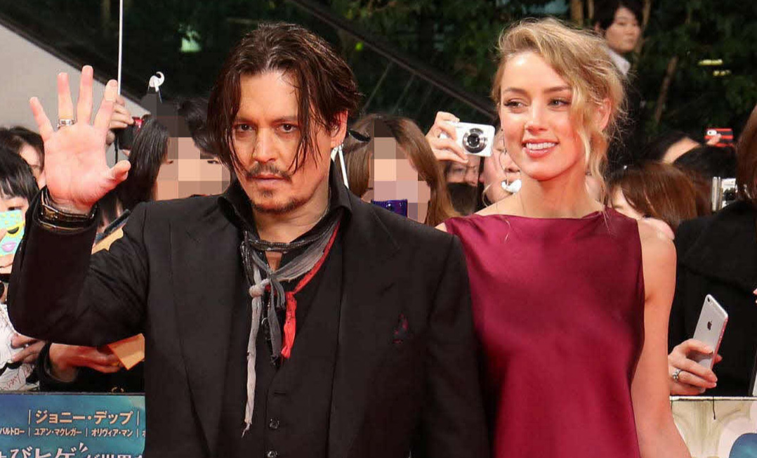 ジョニー・デップ（左）と元妻アンバー・ハード（2015年1月撮影）
