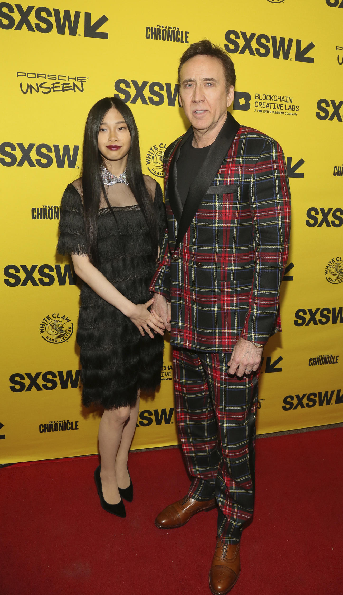 プレミア上映会に出席したニコラス・ケイジと日本人妻リコ・シバタさん（AP）