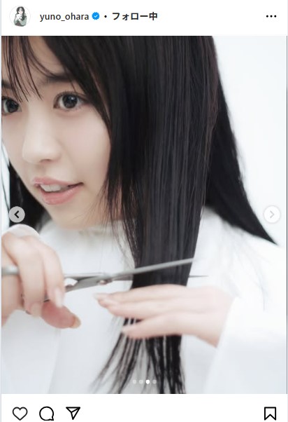 髪にハサミを入れる大原優乃（インスタグラムから）