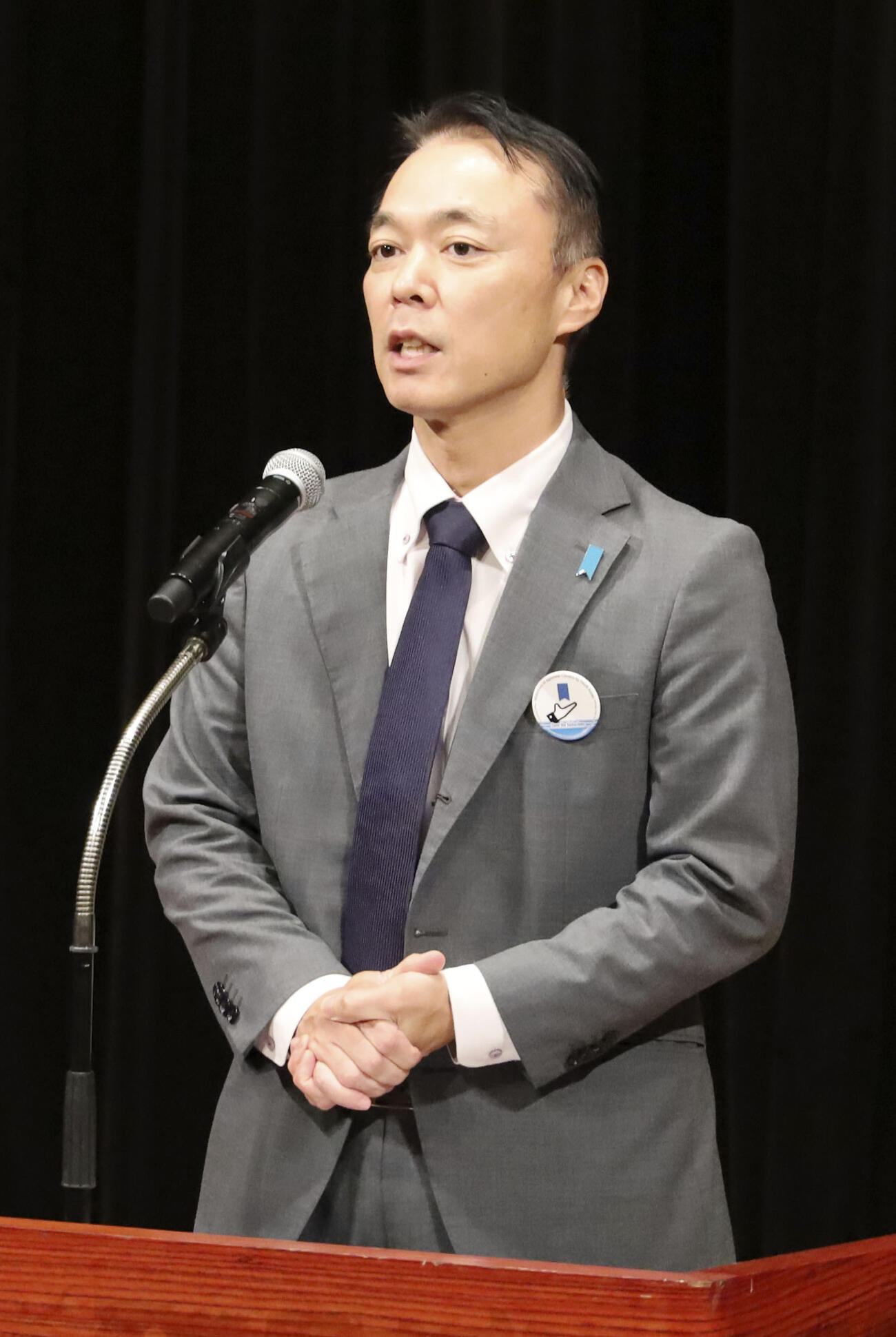 講演する田口八重子さんの長男飯塚耕一郎さん（共同）