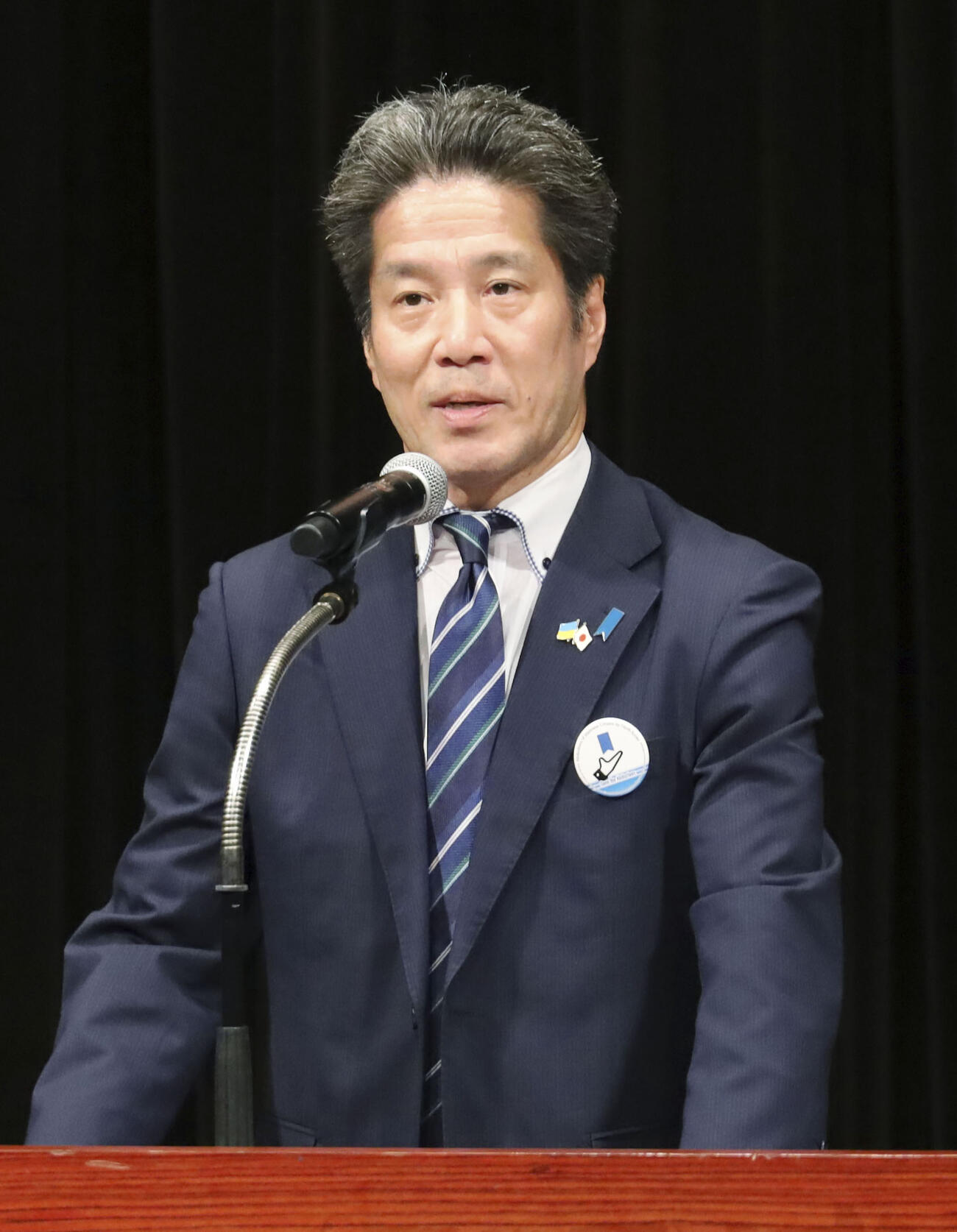 講演する横田めぐみさんの弟哲也さん（共同）