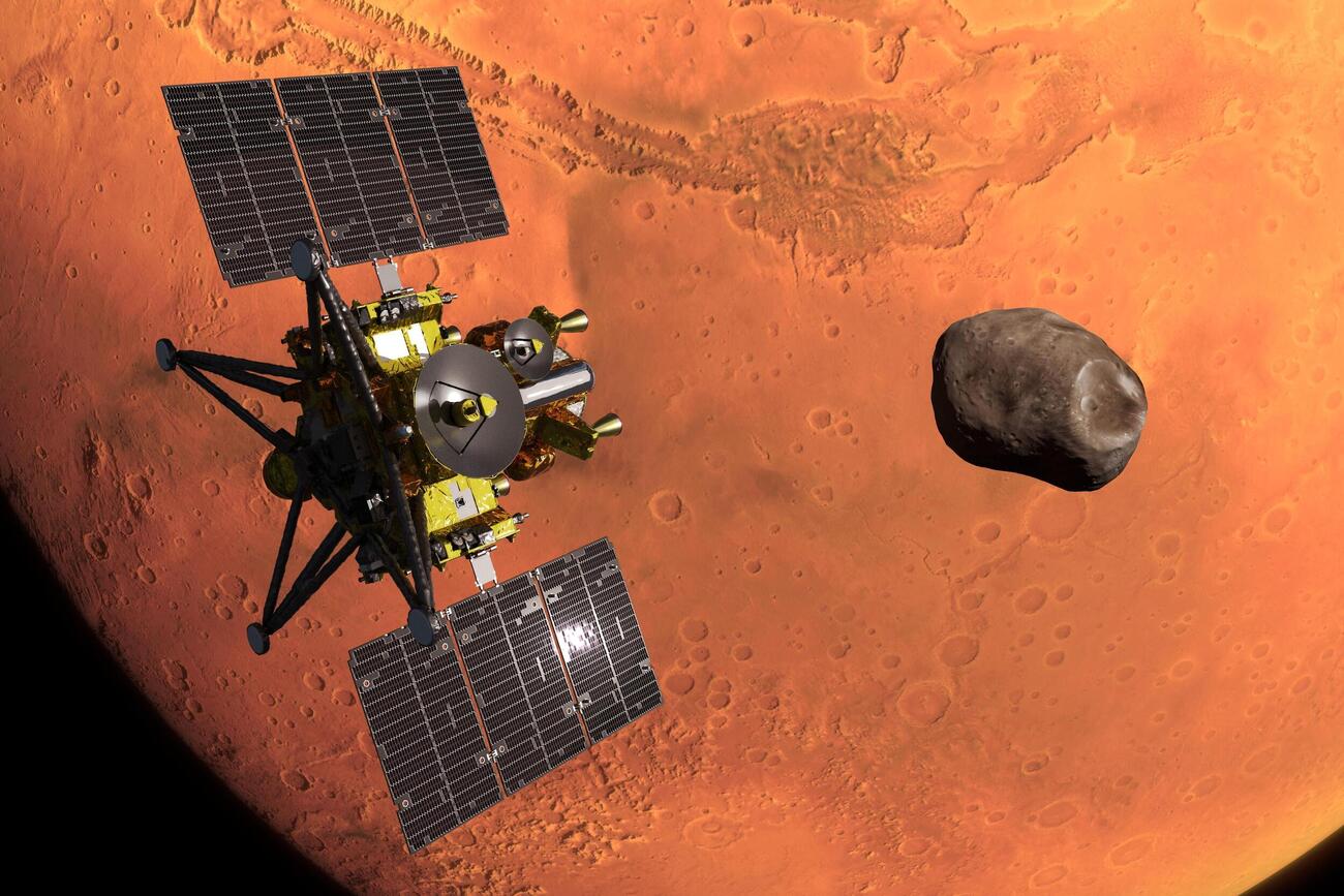 火星の近くに到着した「MMX」の探査機のイメージ（JAXA提供＝共同）