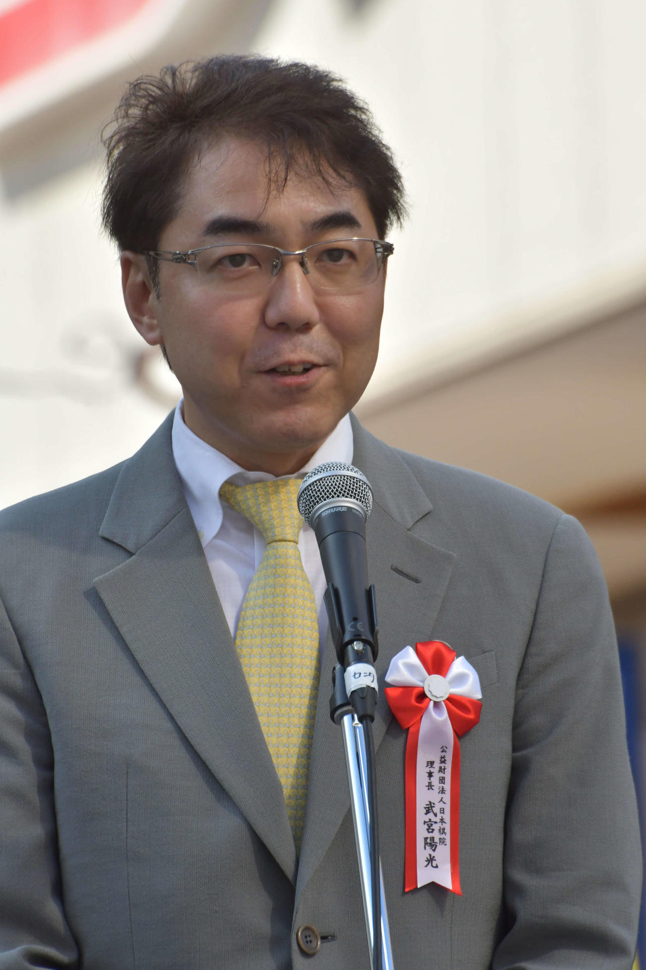 第27回湘南ひらつか囲碁まつり1000面打ち大会であいさつする日本棋院の武宮陽光理事長