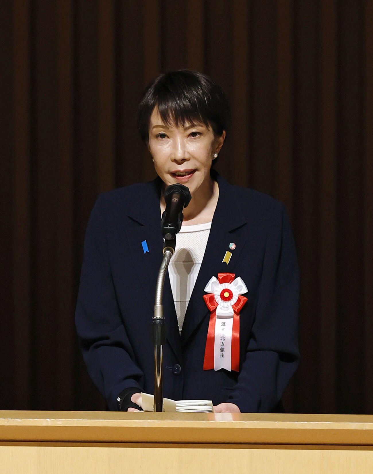 「北方領土返還要求全国大会」であいさつする高市首相（共同）