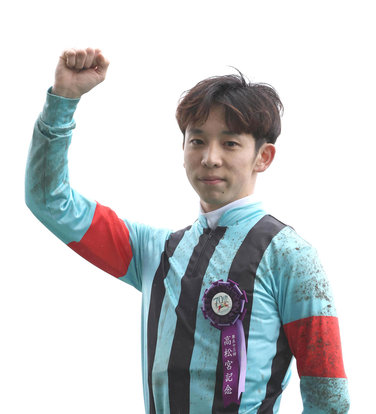 ヒーローインタビューを終えてガッツポーズするG1初制覇の団野騎手（撮影・白石智彦）