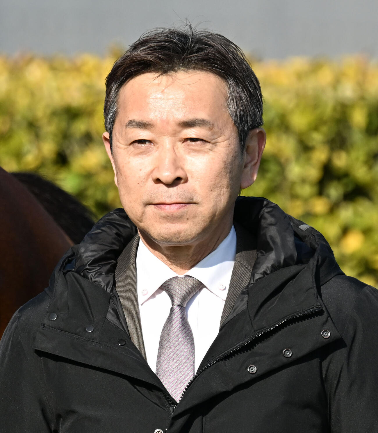 手塚貴久調教師（2026年1月撮影）