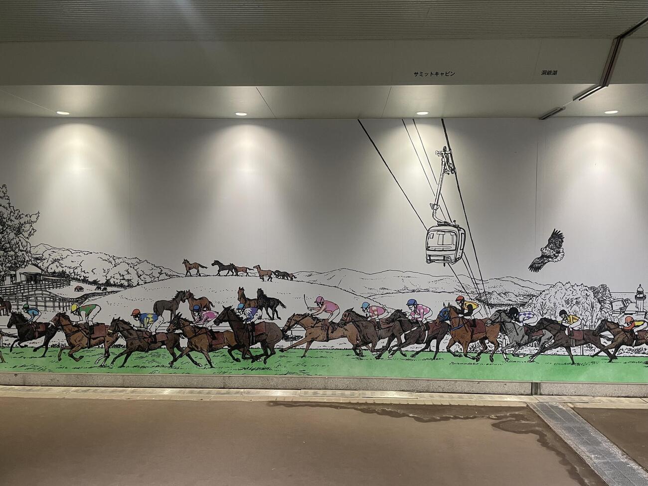 北海道の大自然をバックに疾走する競走馬（撮影・奥岡幹浩）