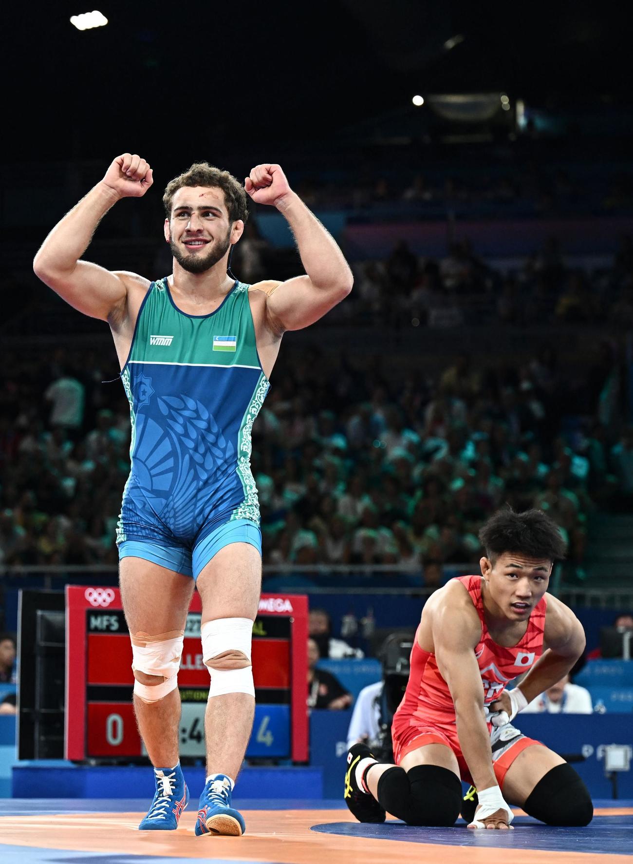 男子フリースタイル74キロ級決勝　ジャマロフ（ウズベキスタン）にフォール負けし、銀メダルとなった高谷大地（ロイター）