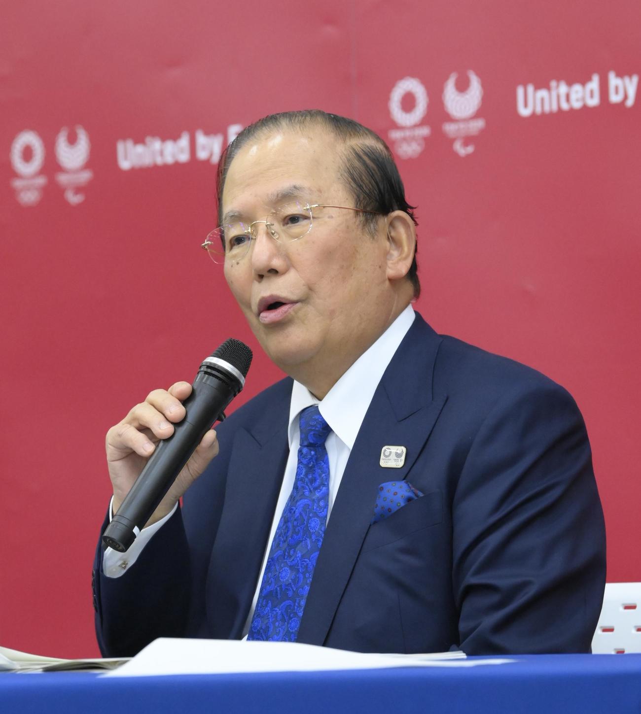 12日、記者会見する武藤事務総長（代表撮影）