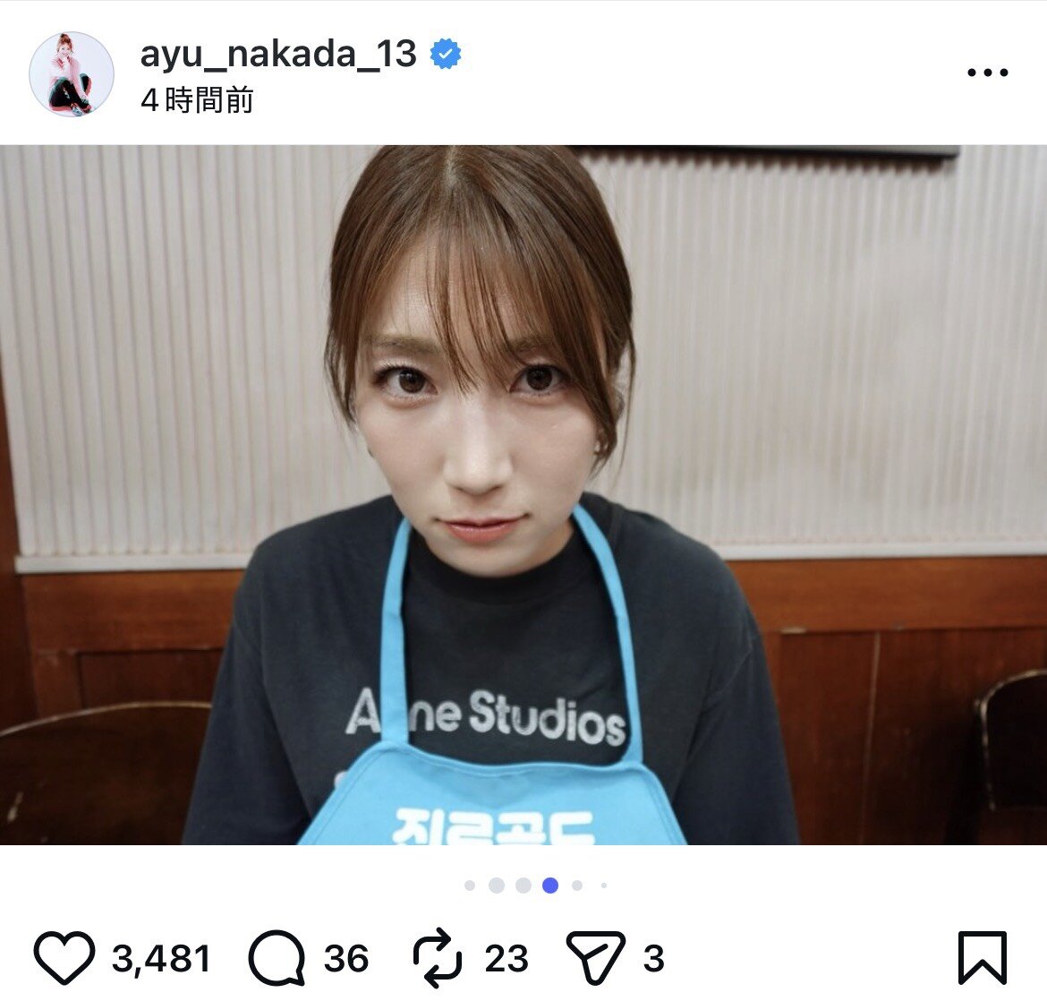 紙エプロン姿でカメラをじっと見つめる仲田歩夢（インスタグラムから）