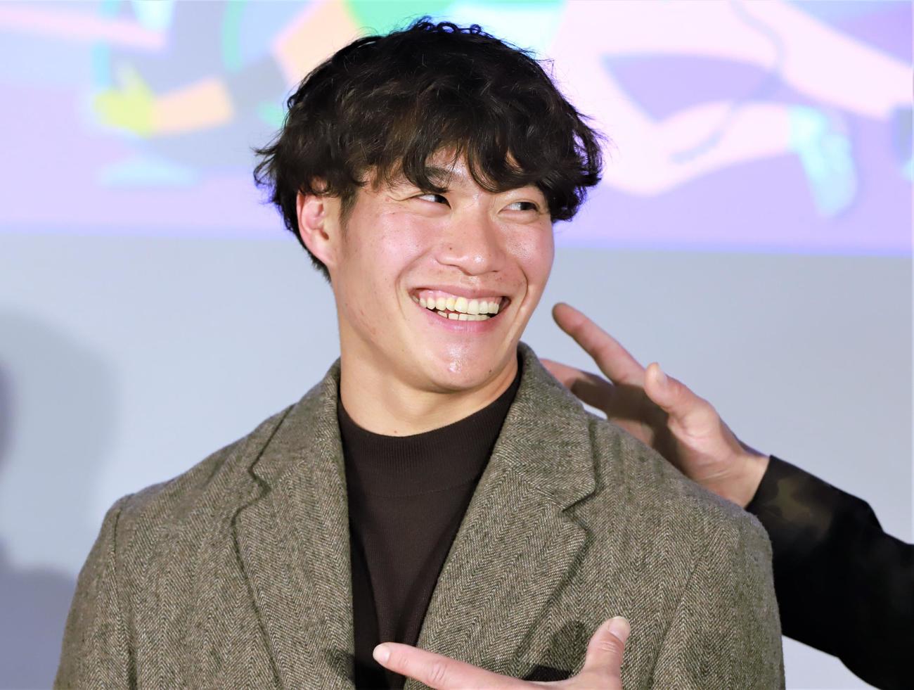 陸上世界選手権イベントで笑顔を見せる男子短距離の坂井隆一郎（撮影・藤塚大輔）