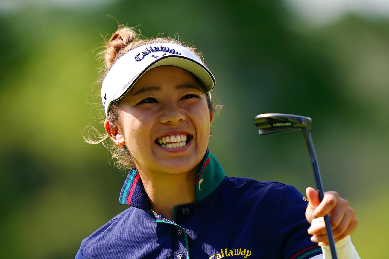 18番、ホールアウトし笑顔を見せる田中（Getty　Images／JLPGA提供）