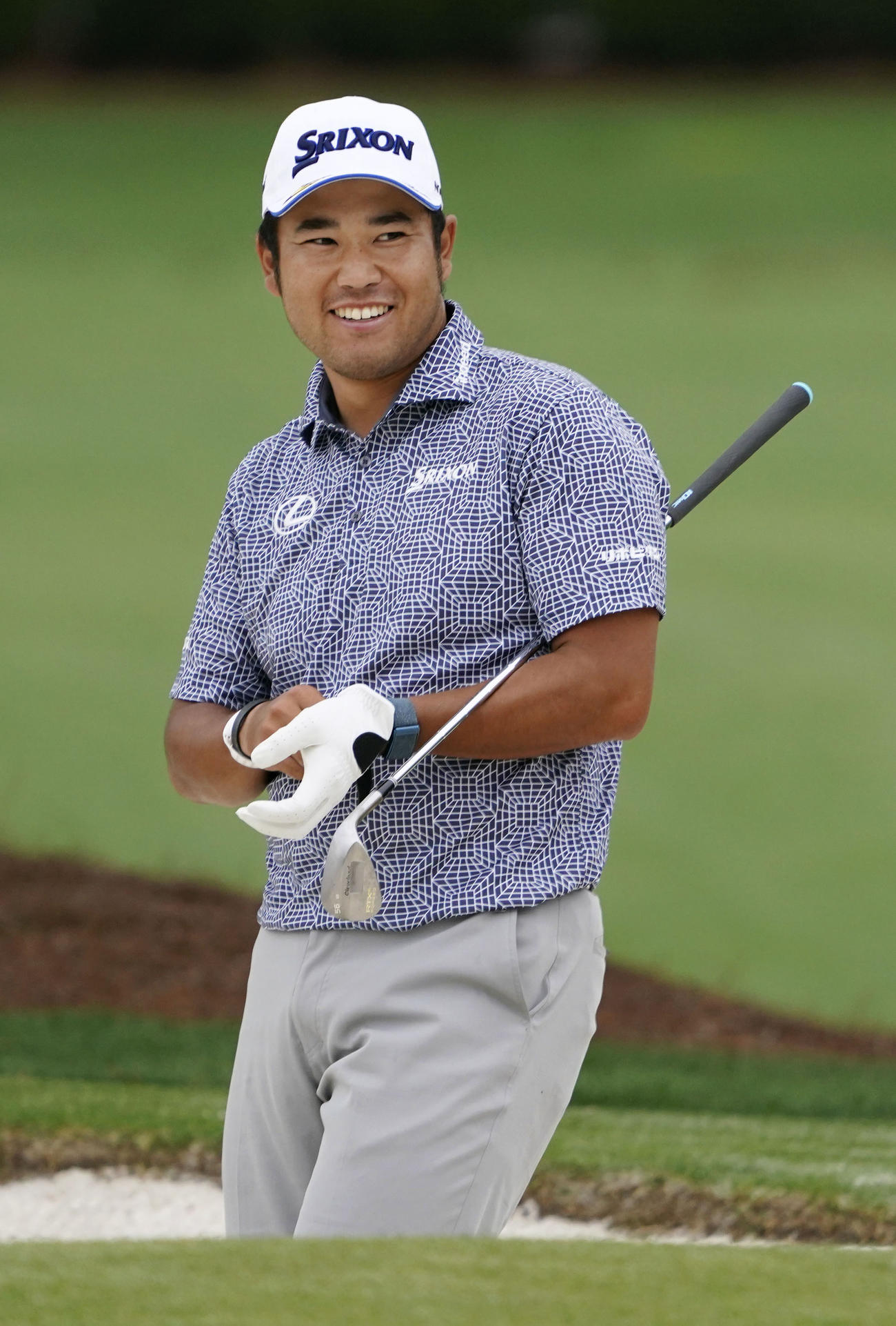 練習場で笑顔を見せる松山英樹＝オーガスタ・ナショナルGC（共同）