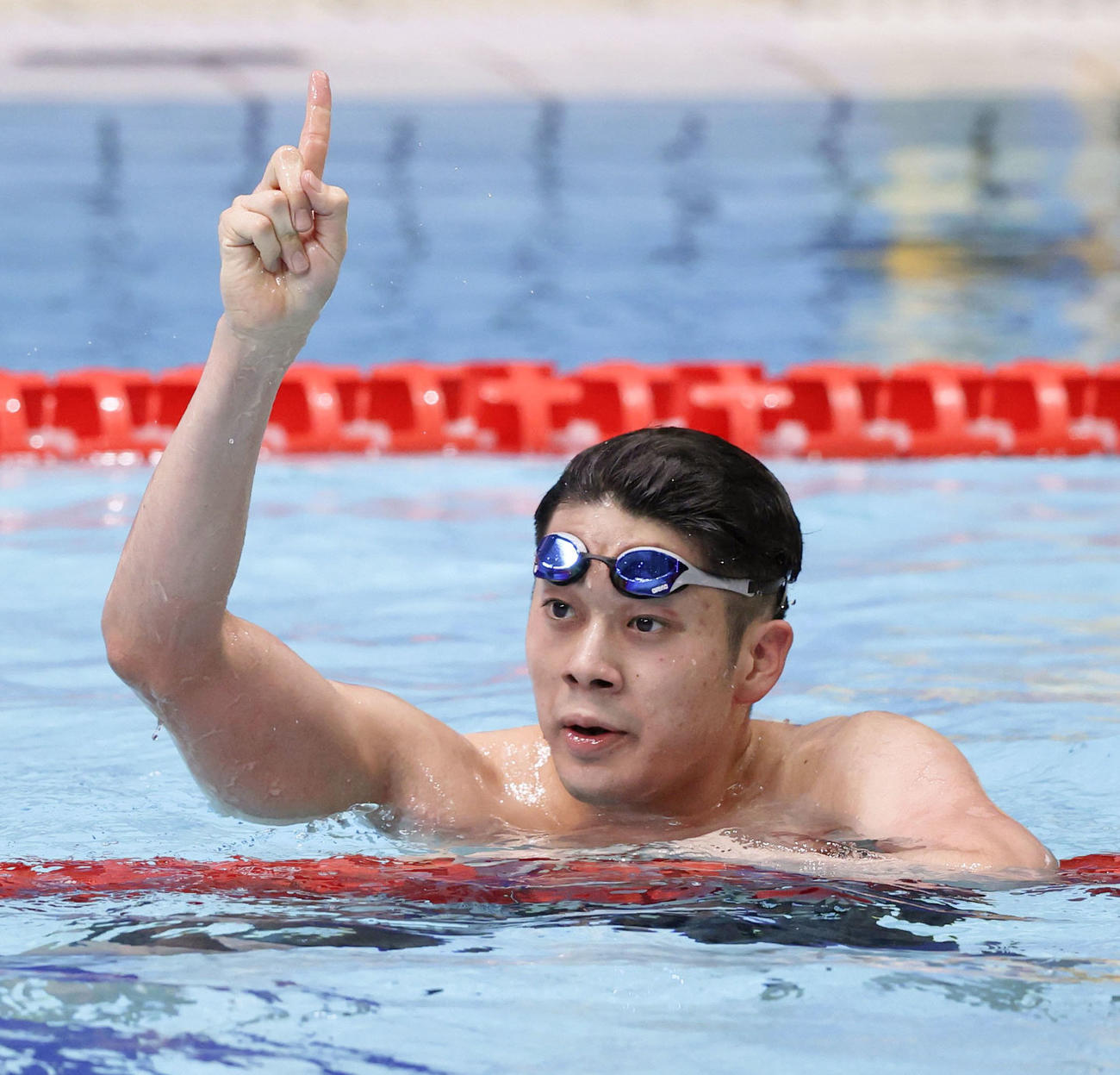 男子100 メートル バタフライを日本新で優勝した水沼尚輝（共同）