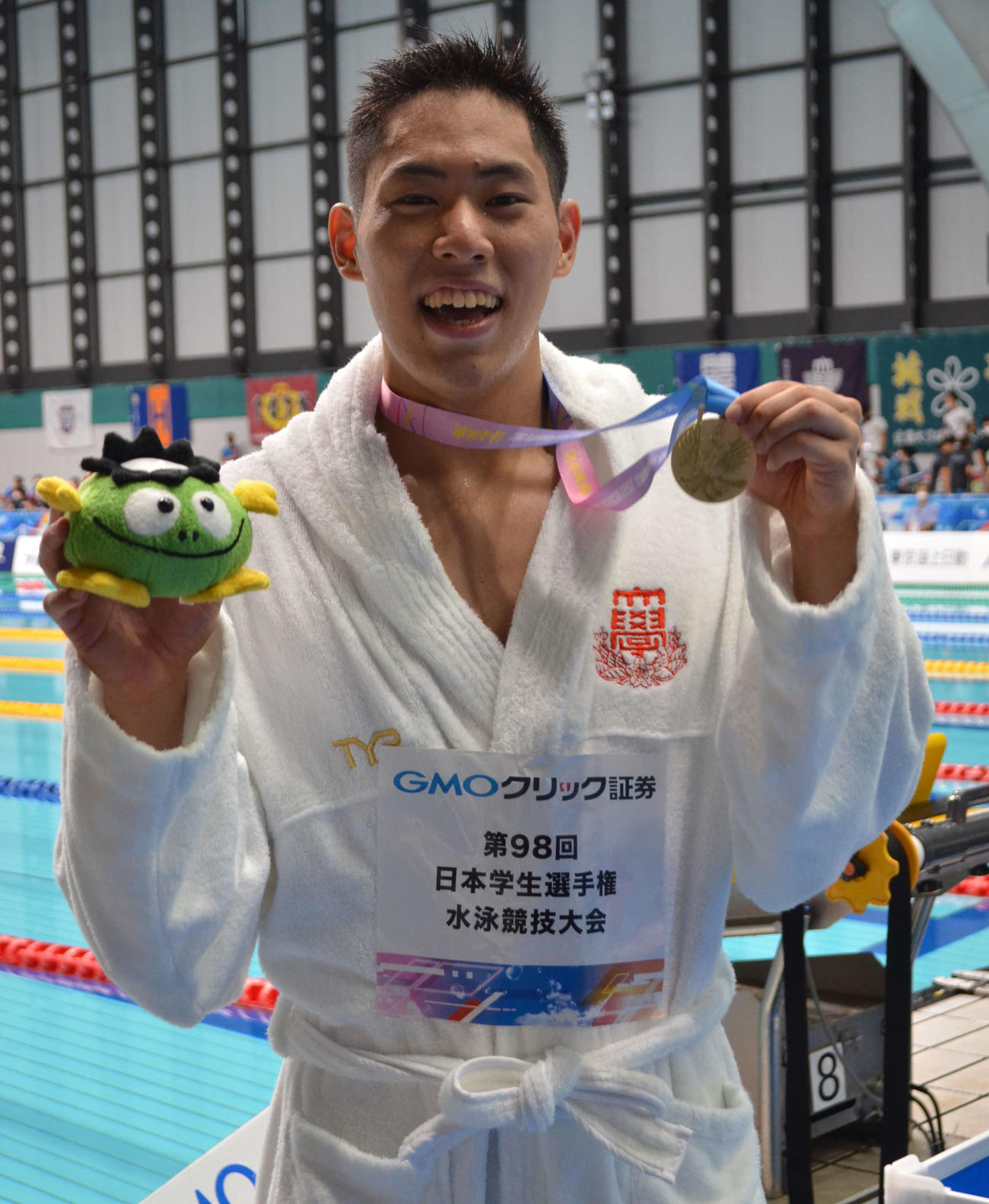 男子200メートルバタフライで大会タイでの3連覇に笑顔の本多灯（撮影・吉池彰）