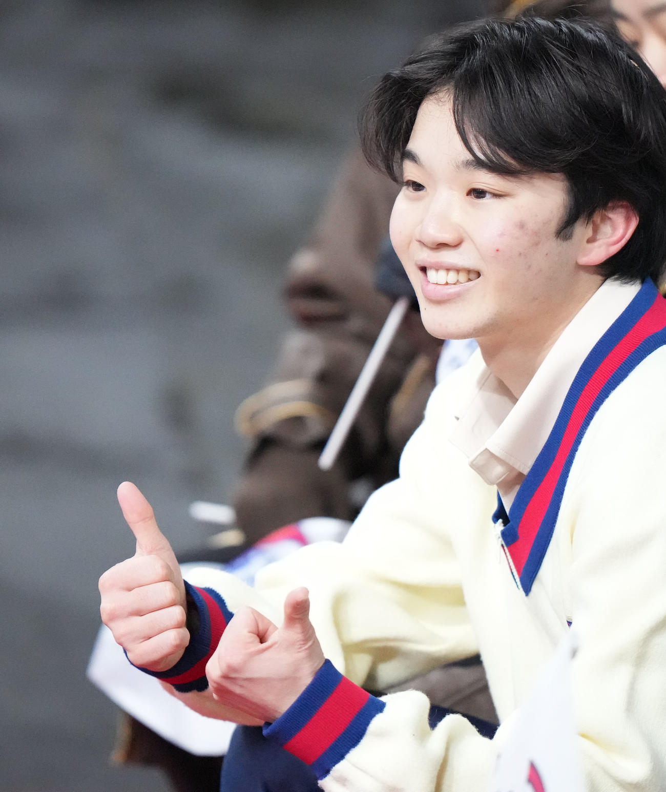 成年男子SPの演技後、笑顔を見せる友野（大阪）（撮影・狩俣裕三）