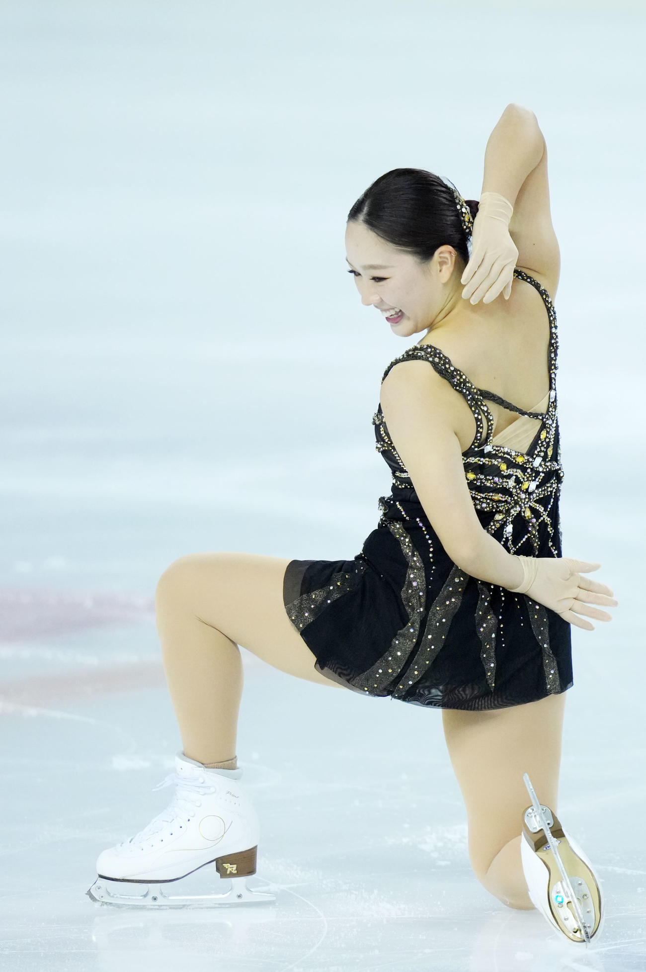 女子SP　演技を終え笑顔を見せる樋口（撮影・横山健太）