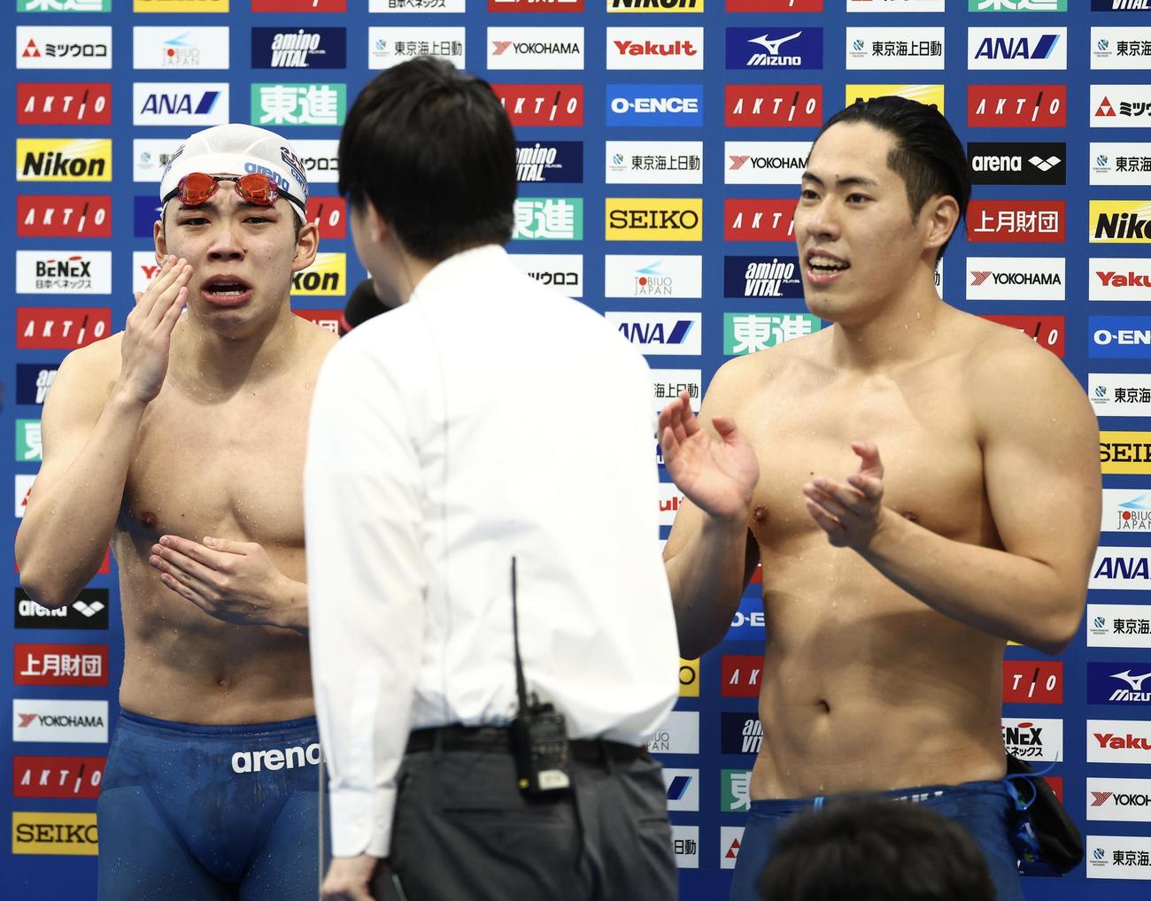 男子200メートルバタフライ決勝　派遣標準記録を突破し、インタビューで涙を浮かべる寺門（左）と本多（撮影・河田真司）