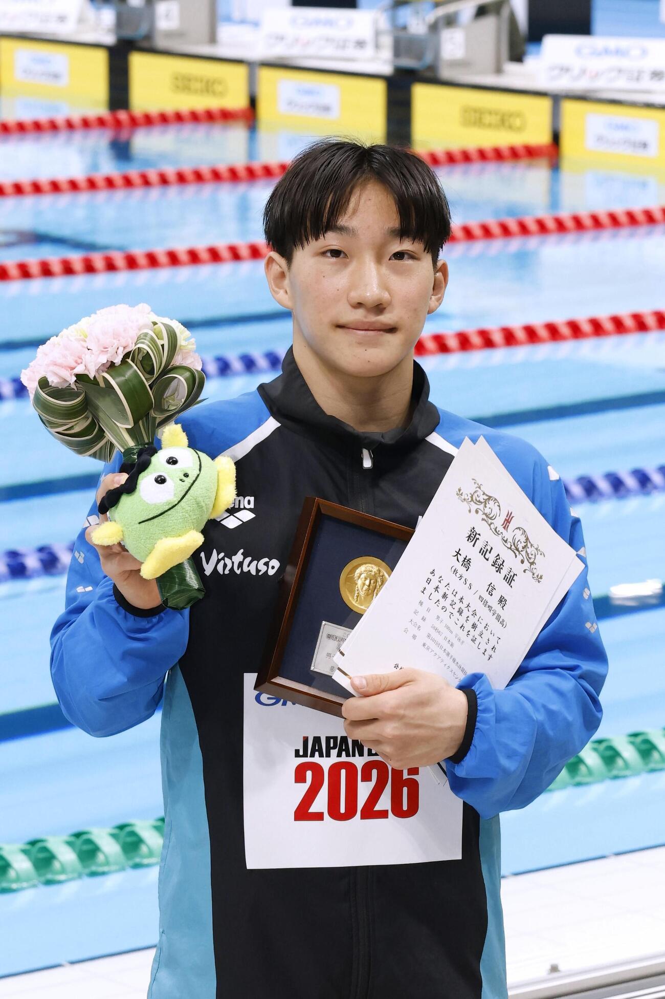 男子100メートル平泳ぎで58秒67の日本新をマークして優勝した大橋信（共同）